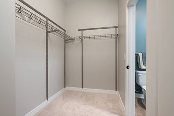 a spacious bathroom with a large walk in closet at the belvedere apartments at Ironwood Flats, Florida, 33511